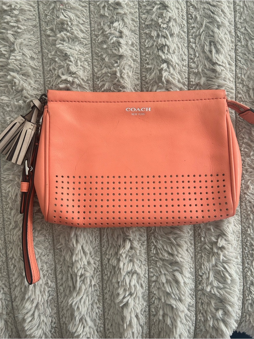 Coach Coral Perforated Leather Wristlet Clutch with Tassel Charm